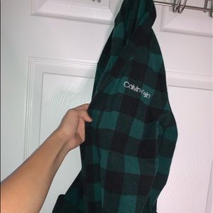 The brand is Calvin Klein the size is a large in kids and the color is green